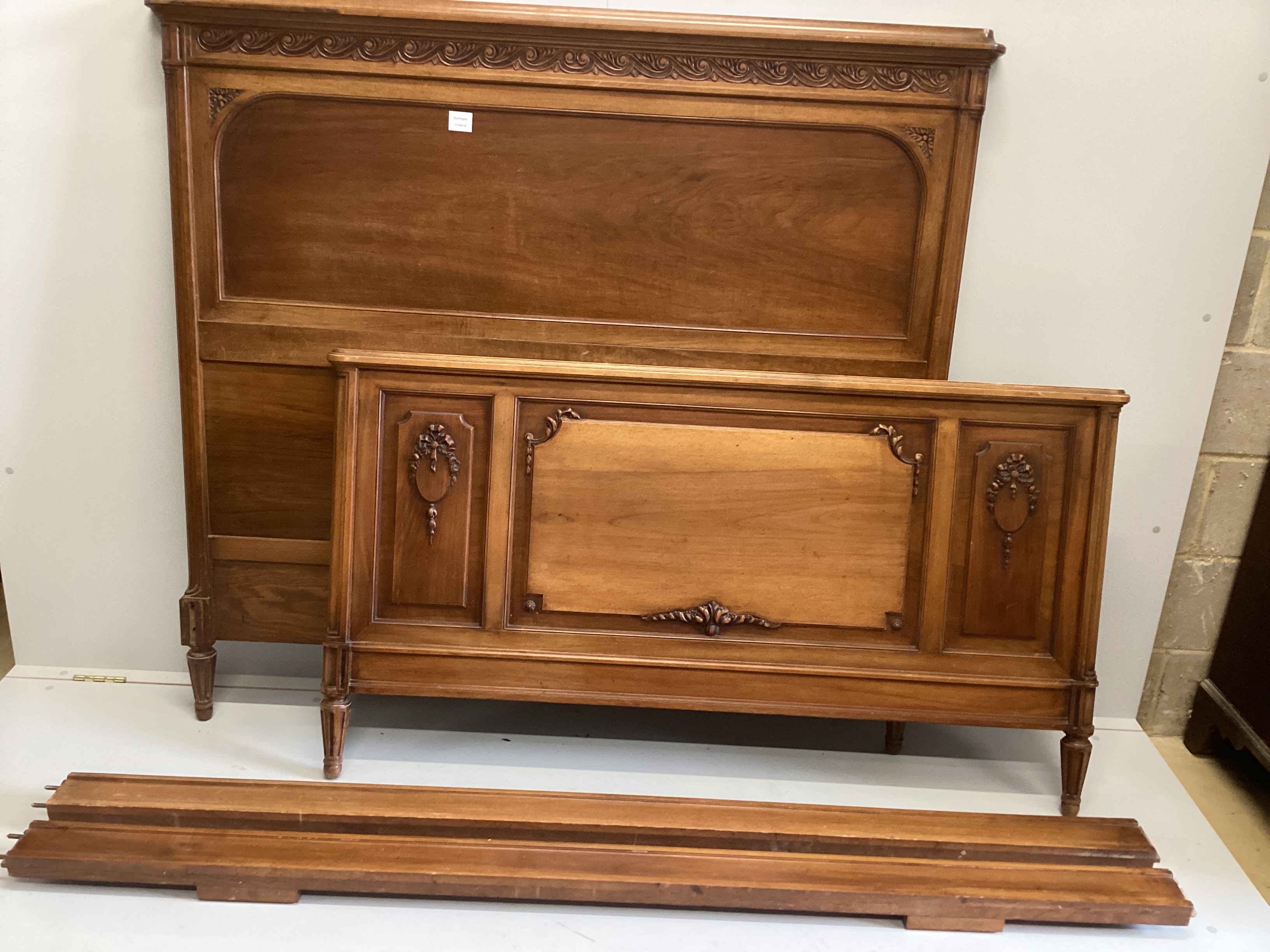 A French neoclassical walnut 4'6'' bedframe, length 204cm, height 139cm